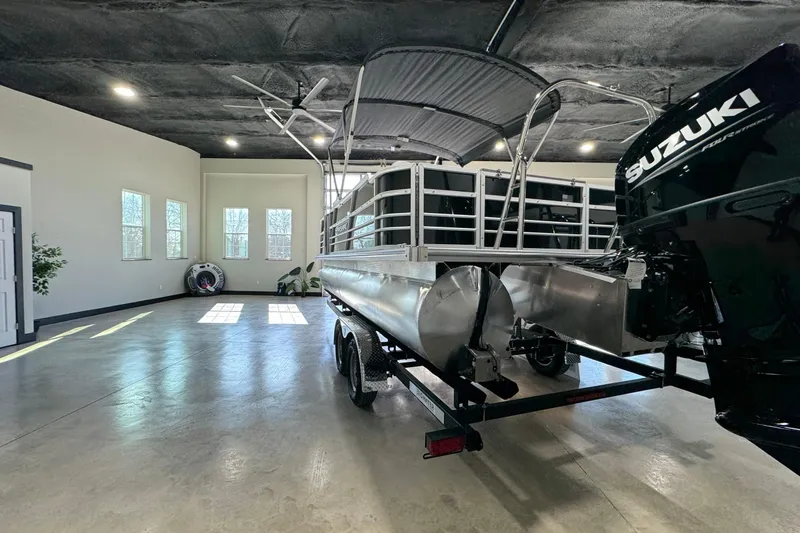 Slide: The Image of 2025 Berkshire 24RFC LE boat dashboard with steering wheel and control panel. - 7