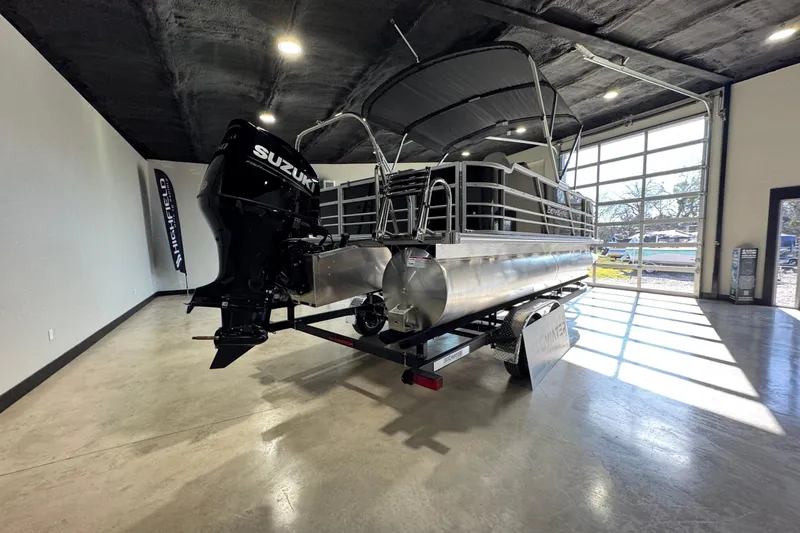 Slide: The Image of 2025 Berkshire 24RFC LE pontoon boat interior with modern seating and helm. - 9