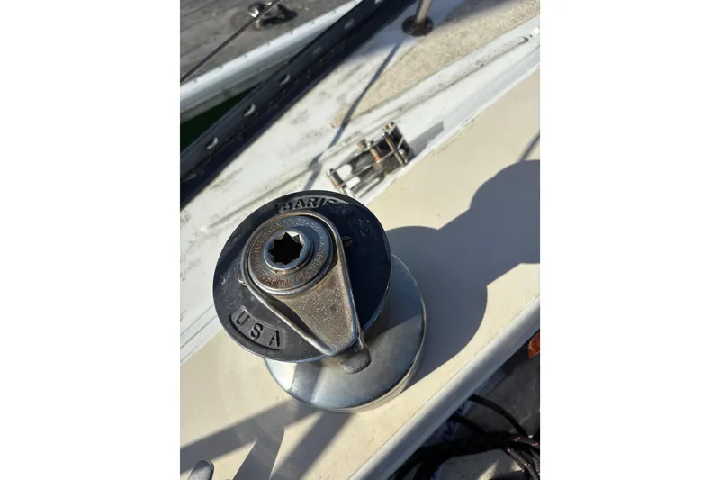 Slide: The Image of 1978 Islander 36 sailboat winch, close-up view, showcasing deck hardware details. - 20