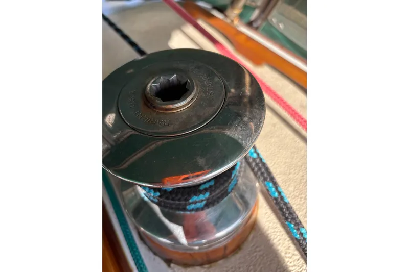 Slide: The Image of Winch on 1978 Islander 36 sailboat with colorful ropes. - 21