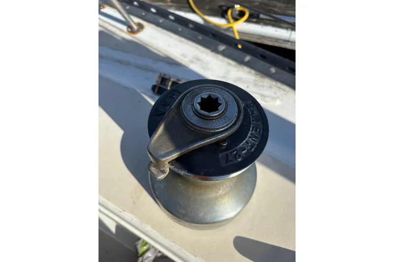 Slide: The Image of Winch on 1978 Islander 36 sailboat deck, close-up view. - 23