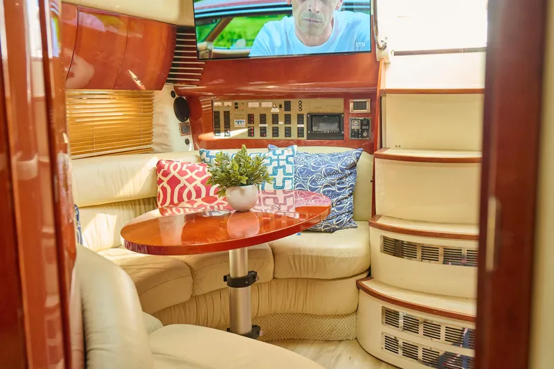 Slide: The Image of Luxurious interior of 2001 Fairline 43 yacht with plush seating and modern amenities. - 13