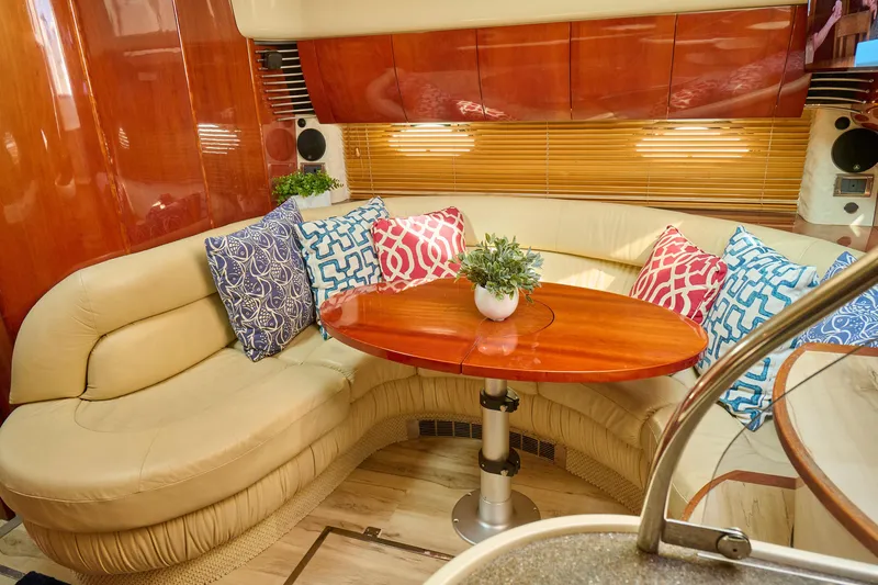 Slide: The Image of Luxurious interior of 2001 Fairline 43 yacht with plush seating and decorative cushions. - 14