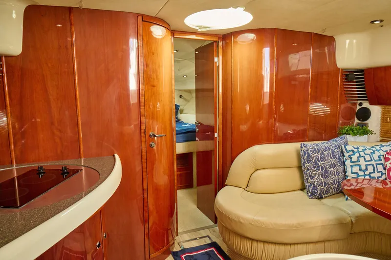 Slide: The Image of Luxurious interior of a 2001 Fairline 43 yacht with wood paneling and plush seating. - 15