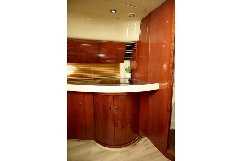 Slide: The Image of Luxurious interior of 2001 Fairline 43 yacht with polished wood cabinetry. - 24