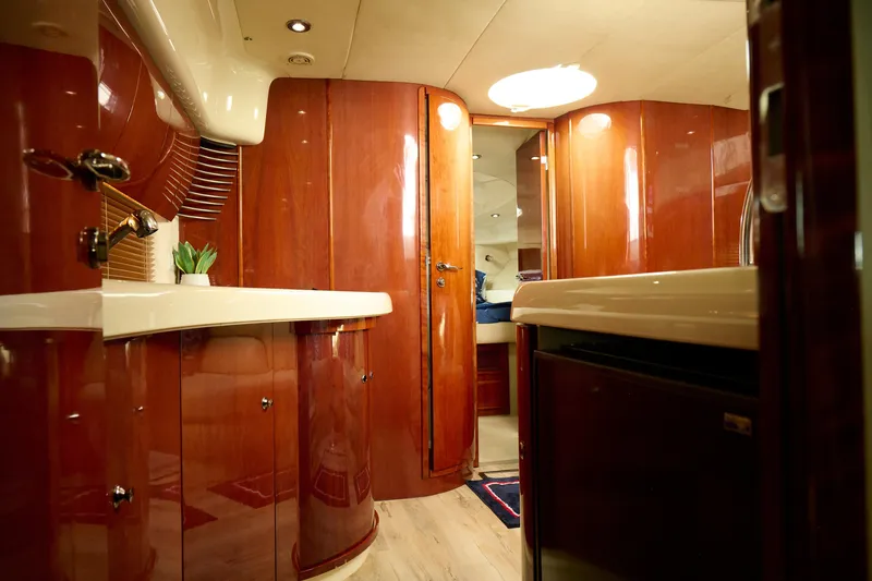 Slide: The Image of Luxurious interior of a 2001 Fairline 43 yacht with polished wood finishes. - 27