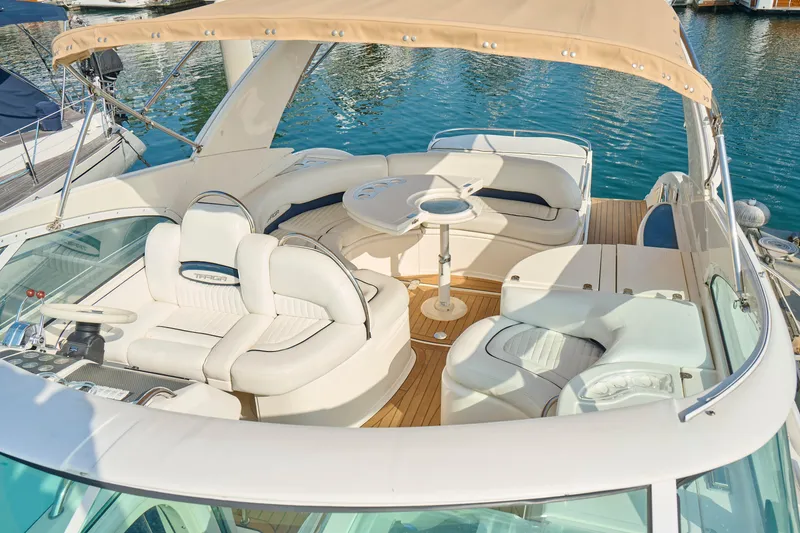 Slide: The Image of Luxury Fairline 43 yacht interior, 2001 model, featuring elegant seating and a stylish helm. - 38