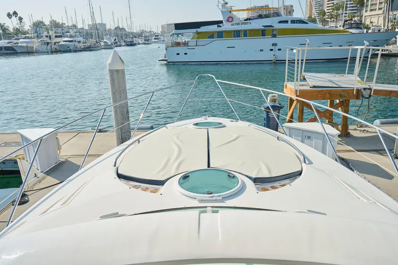 Slide: The Image of 2001 Fairline 43 yacht docked at marina with other boats in background. - 42