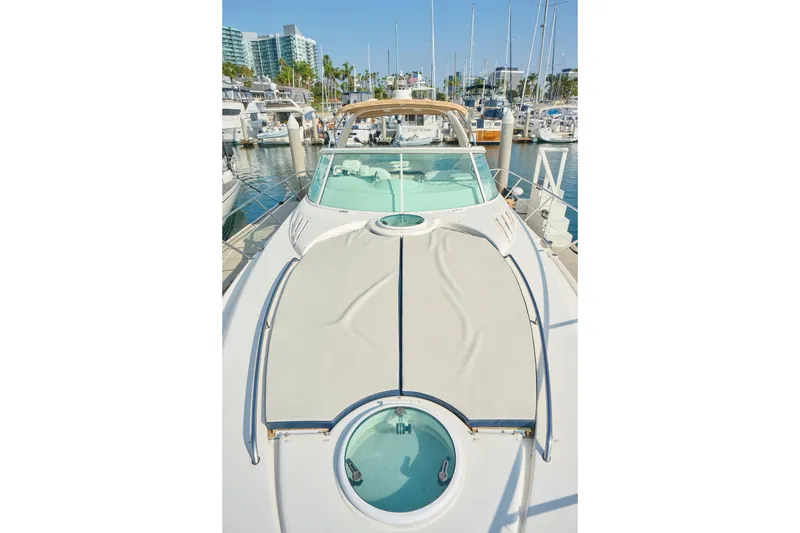 Slide: The Image of 2001 Fairline 43 yacht docked in marina, showcasing sleek design and spacious deck. - 43
