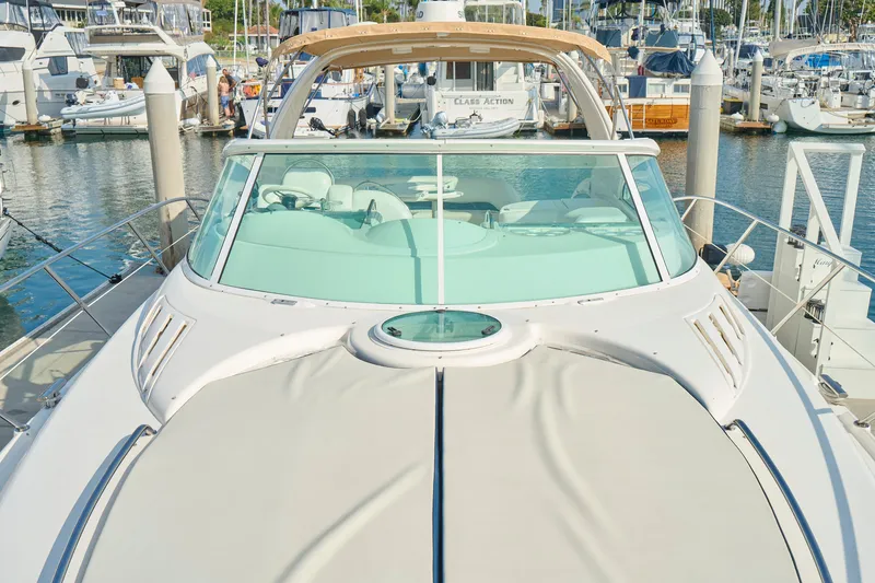 Slide: The Image of Luxury 2001 Fairline 43 yacht docked in a marina, showcasing sleek design and spacious deck. - 44