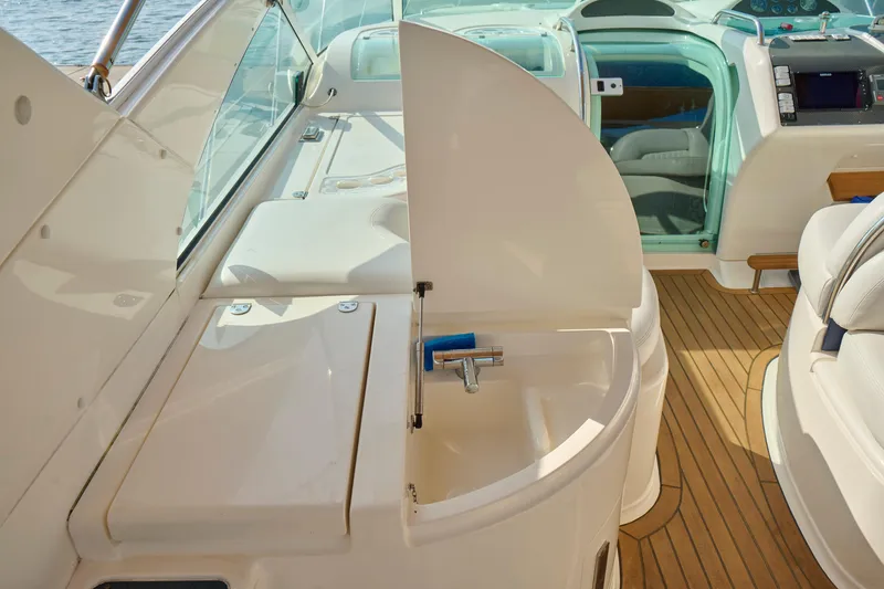Slide: The Image of Interior of 2001 Fairline 43 yacht featuring a compact sink and wooden flooring. - 46