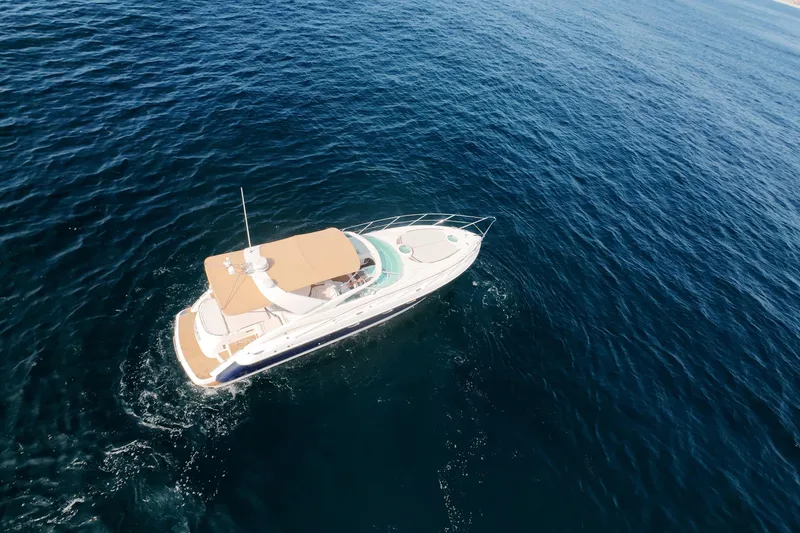 Slide: The Image of Aerial view of 2001 Fairline 43 yacht cruising on open blue sea. - 53