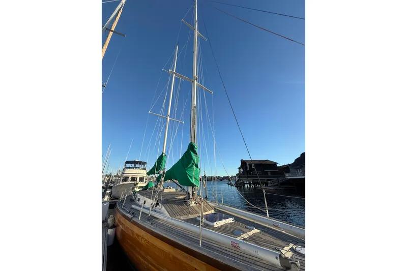 Slide: The Image of Custom 49' Schooner by Chuck Burns, 2007, docked under clear blue sky. - 10