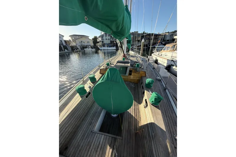 Slide: The Image of Custom 49' Schooner by Chuck Burns, 2007, docked with green covers on deck. - 13