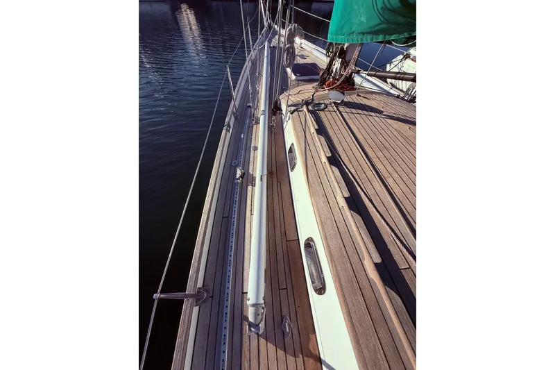 Slide: The Image of Custom 49' Schooner by Chuck Burns, 2007, featuring a sleek wooden deck design. - 17