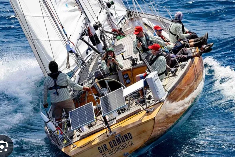 Slide: The Image of Sailing crew on Chuck Burns Custom 49' Schooner, 2007, navigating ocean waves. - 2