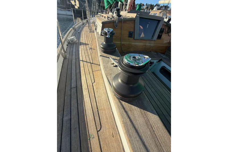 Slide: The Image of Wooden deck of 2007 Chuck Burns Custom 49' Schooner with winches and hatch. - 20