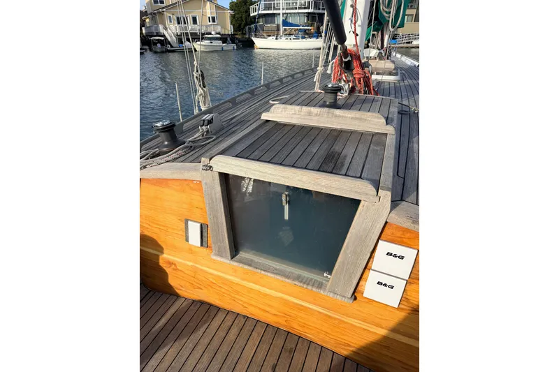 Slide: The Image of Custom 49' Schooner by Chuck Burns, 2007, featuring wooden deck and cabin details. - 23