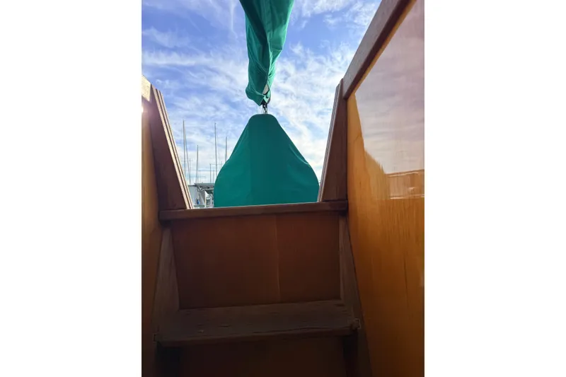 Slide: The Image of Wooden stairs leading to deck of 2007 Chuck Burns Custom 49' Schooner under blue sky. - 24