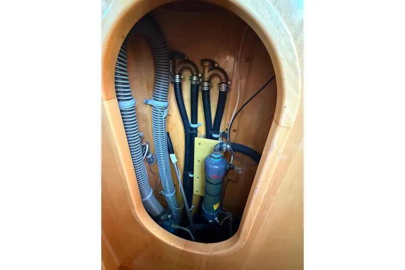 Slide: The Image of Interior view of 2007 Chuck Burns Custom 49' Schooner showing plumbing and wiring components. - 27