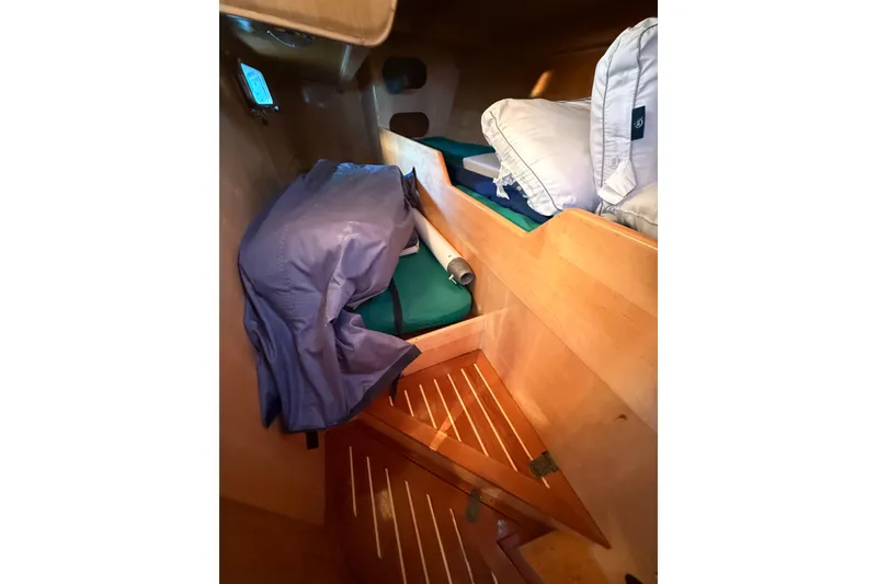 Slide: The Image of Cozy cabin interior of 2007 Chuck Burns Custom 49' Schooner with wooden finish and bedding. - 28