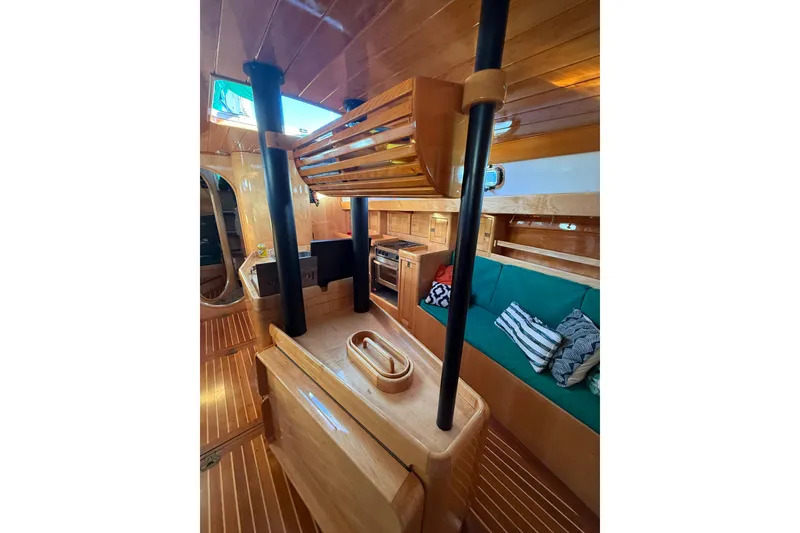 Slide: The Image of Interior of 2007 Chuck Burns Custom 49' Schooner with wooden finish and cozy seating area. - 32