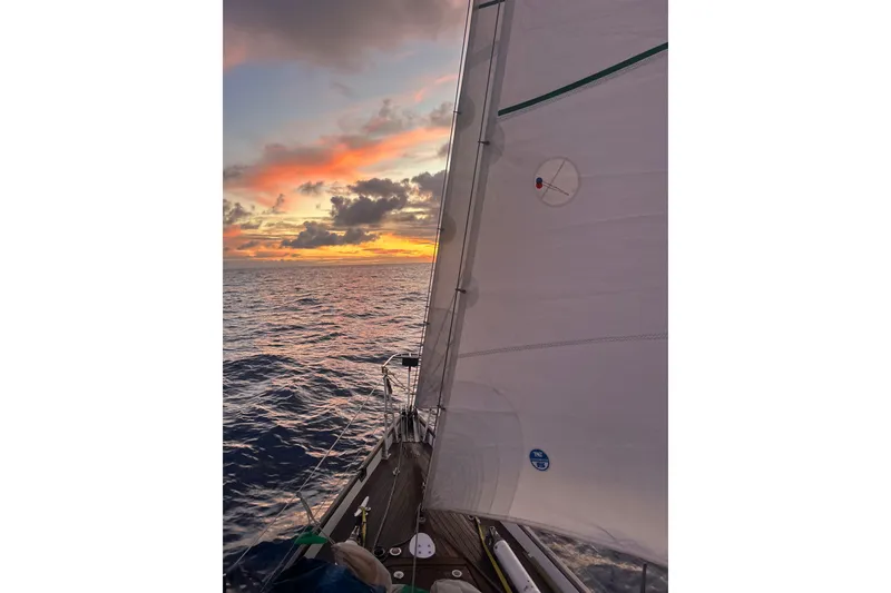 Slide: The Image of Sailing at sunset on a 2007 Chuck Burns Custom 49' Schooner, vibrant sky and ocean view. - 4