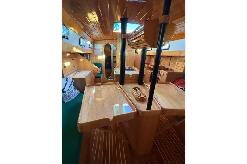 Slide: The Image of Luxurious wooden interior of a 2007 Chuck Burns Custom 49' Schooner, featuring elegant craftsmanship. - 50