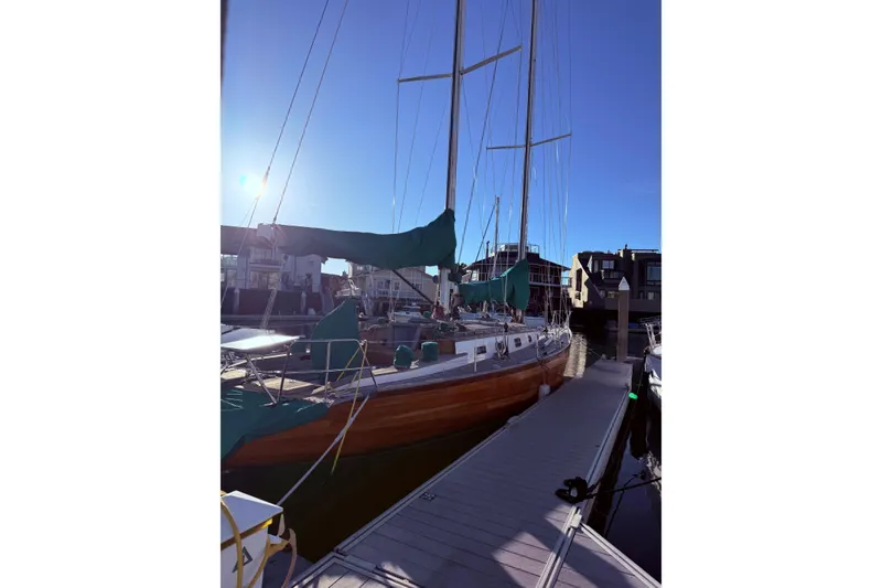 Slide: The Image of Custom 49' Schooner by Chuck Burns, 2007, docked under clear blue sky. - 6