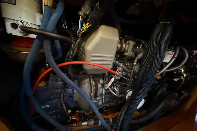 Slide: The Image of Engine compartment of a 2007 Chuck Burns Custom 49' Schooner with visible wiring and hoses. - 67