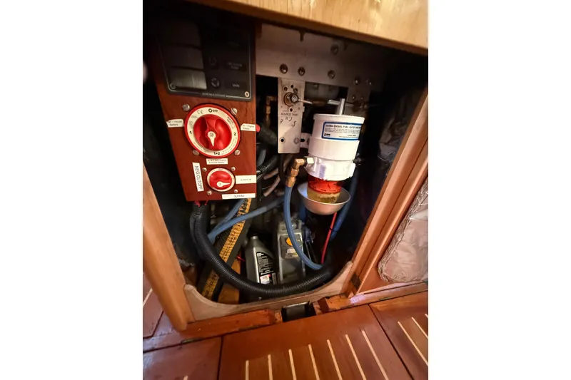 Slide: The Image of Engine compartment of 2007 Chuck Burns Custom 49' Schooner, featuring control panel and fuel filter. - 69