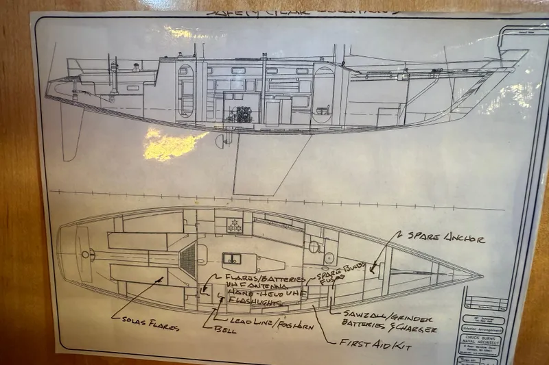 Slide: The Image of Blueprint of 2007 Chuck Burns Custom 49' Schooner with labeled safety equipment locations. - 71