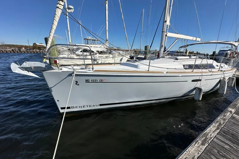 Slide: The Image of 2015 Beneteau Oceanis 37 sailboat docked at marina on a sunny day. - 3