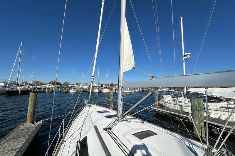 Slide: The Image of Beneteau Oceanis 37 sailboat docked at marina, clear blue sky, 2015 model. - 7