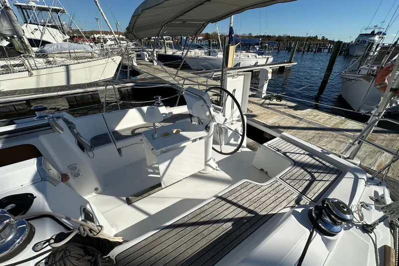 Slide: The Image of Cockpit of 2015 Beneteau Oceanis 37 sailboat docked at marina. - 8