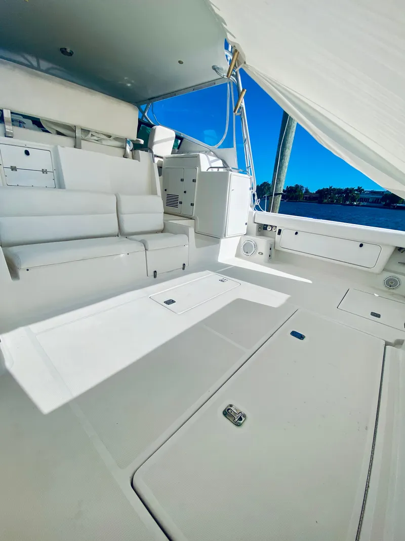 Slide: The Image of 1999 Tiara Yachts 43 Open interior, featuring spacious seating and sleek design. - 37