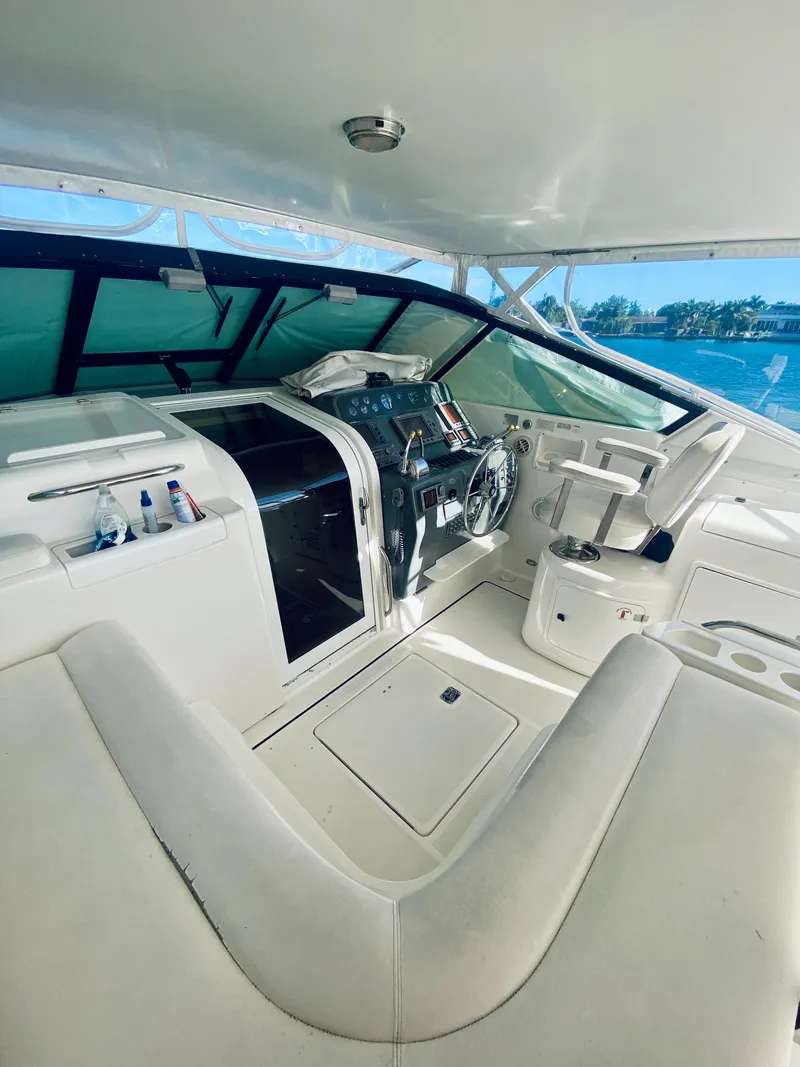 Slide: The Image of 1999 Tiara Yachts 43 Open cockpit with steering wheel and seating area. - 39