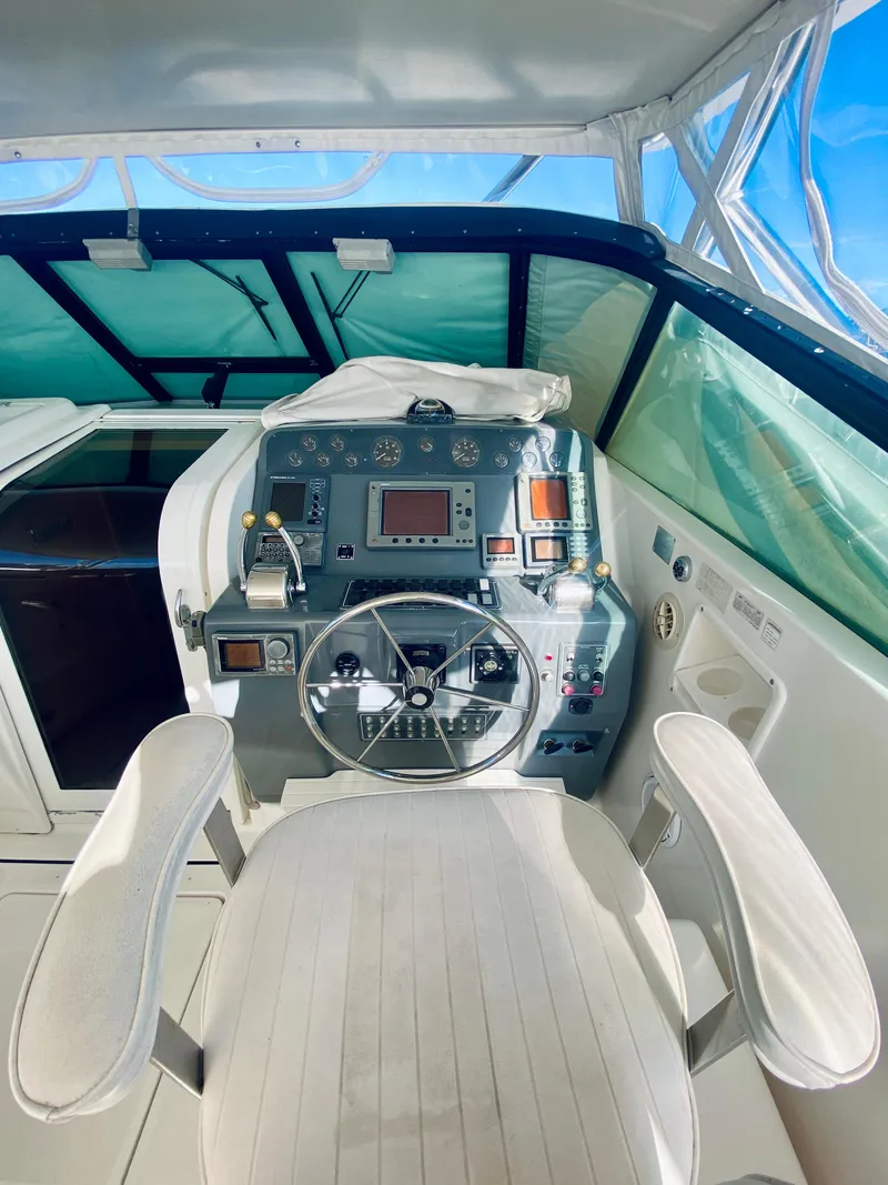 Slide: The Image of 1999 Tiara Yachts 43 Open helm with modern controls and panoramic view. - 40