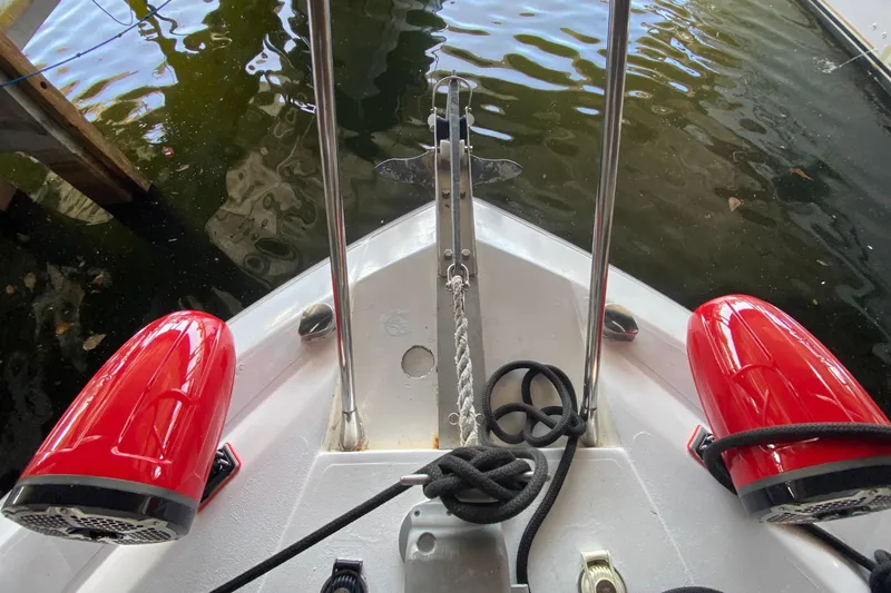 Slide: The Image of Bow of 1993 Wellcraft 4300 Portofino with red speakers and anchor rope. - 14