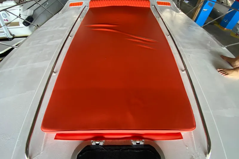 Slide: The Image of 1993 Wellcraft 4300 Portofino boat deck with red sunpad and railing. - 15