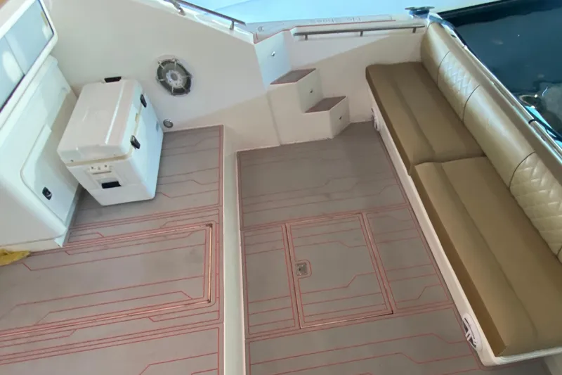 Slide: The Image of 1993 Wellcraft 4300 Portofino boat interior with seating and cooler. - 22