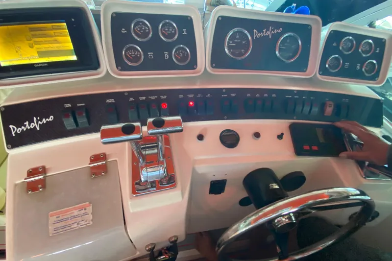 Slide: The Image of Control panel of a 1993 Wellcraft 4300 Portofino boat with gauges and switches. - 23