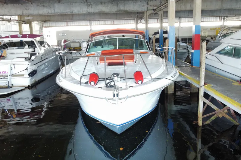 Slide: The Image of 1993 Wellcraft 4300 Portofino yacht docked in a marina, front view. - 3