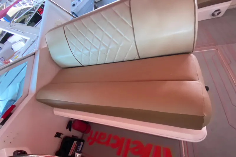 Slide: The Image of 1993 Wellcraft 4300 Portofino boat interior with tan leather seating. - 31