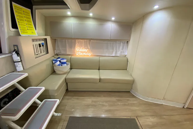 Slide: The Image of Interior of 1993 Wellcraft 4300 Portofino yacht with seating and "Happy Birthday" sign. - 35