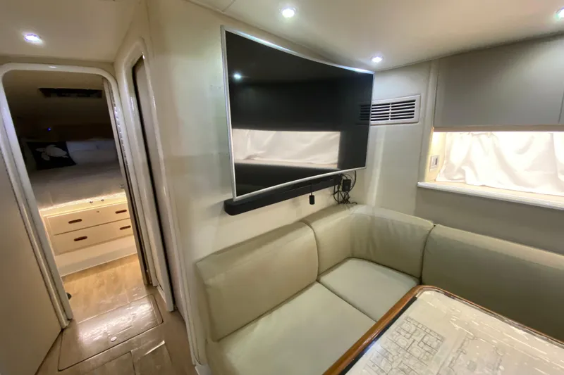 Slide: The Image of Interior of 1993 Wellcraft 4300 Portofino yacht with modern seating and TV. - 37
