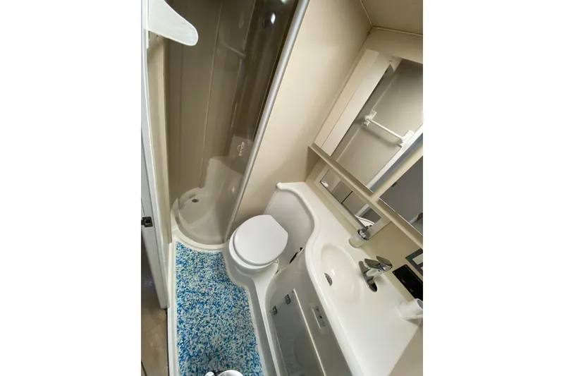 Slide: The Image of Bathroom interior of 1993 Wellcraft 4300 Portofino yacht with shower, toilet, and sink. - 39