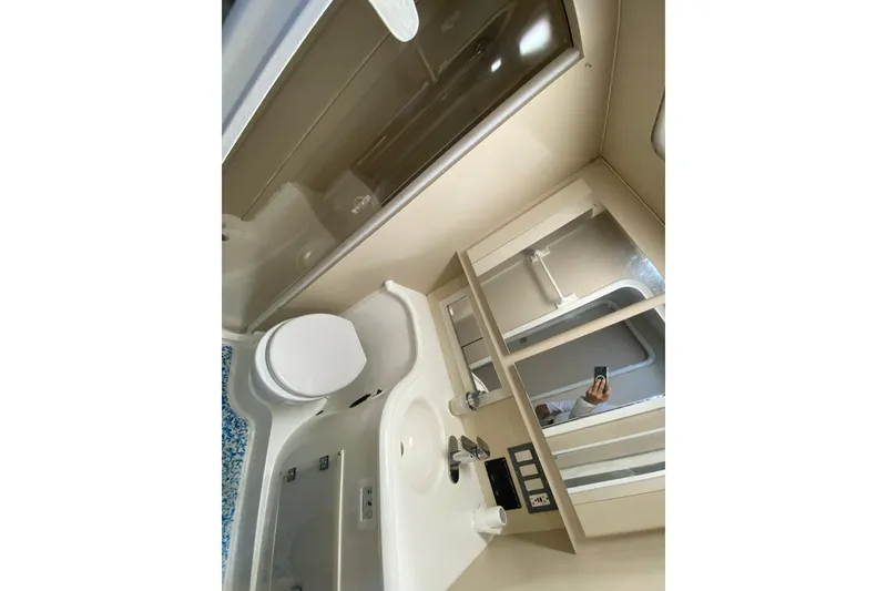 Slide: The Image of Bathroom interior of 1993 Wellcraft 4300 Portofino yacht, featuring shower, toilet, and sink. - 40