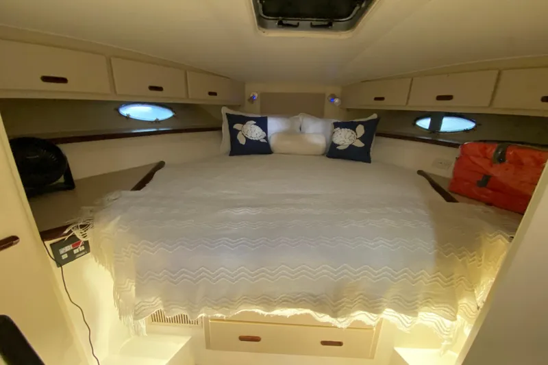 Slide: The Image of Cozy cabin interior of 1993 Wellcraft 4300 Portofino with bed and storage. - 41