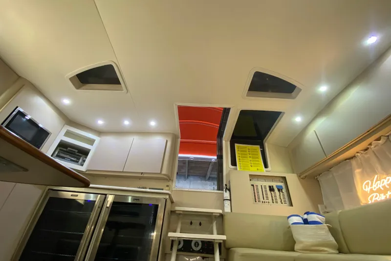 Slide: The Image of Interior of 1993 Wellcraft 4300 Portofino yacht, featuring modern amenities and lighting. - 45